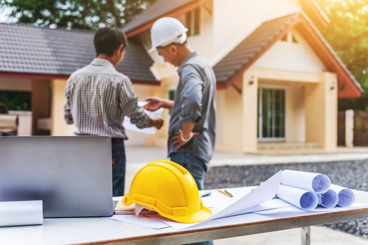 Two business man professional engineer worker at the house build Two business man professional engineer worker at the house building, happy feeling.